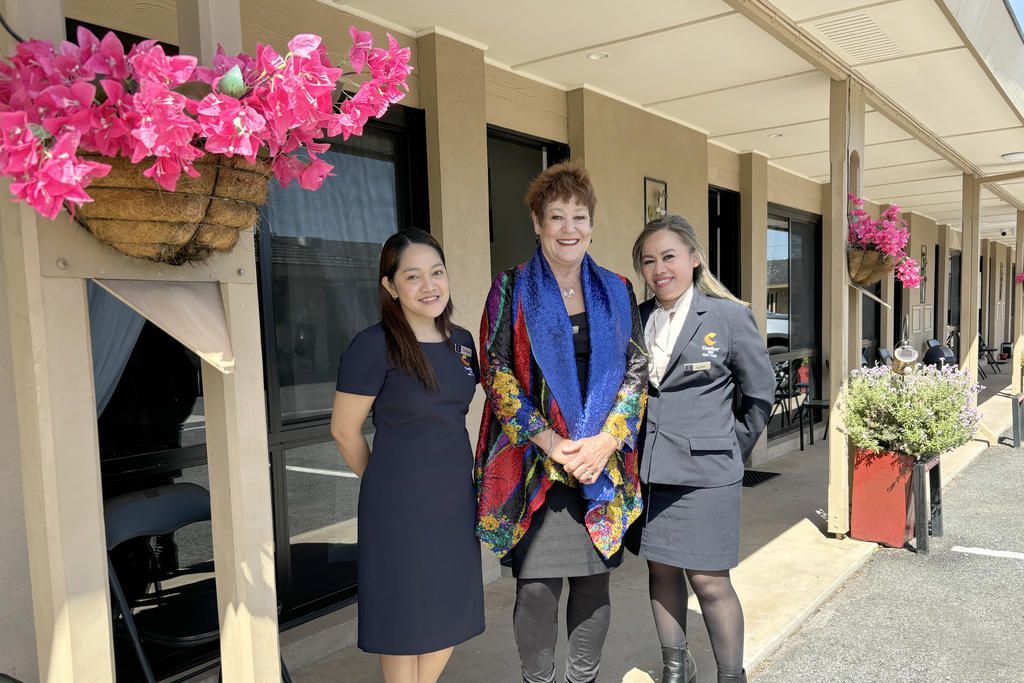 Comfort Inn May Park owner Liz Dahlenburg (middle) with guest services and media specialist Clariza Pepito (left) and guest services manager Lynn Aneban. Photo: CAITLIN MENADUE