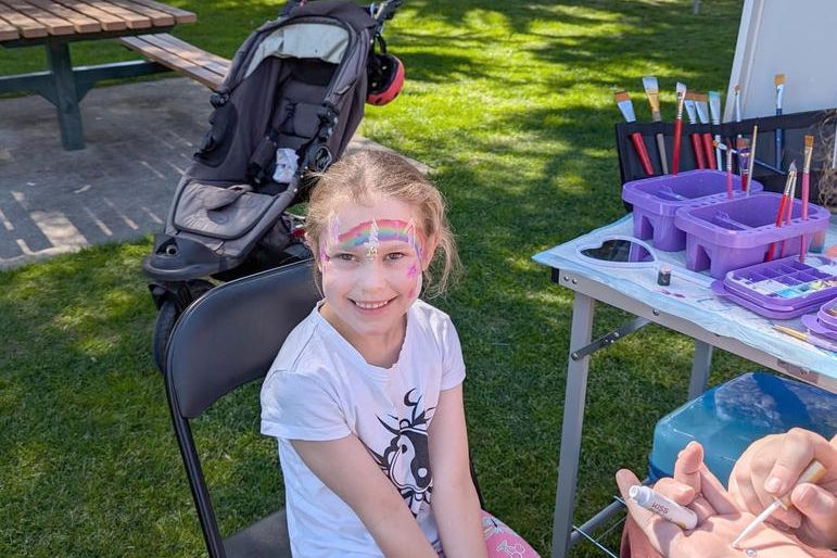 Brianca is all smiles after having her face painted by Samantha Smith. Is it Brianca or Bianca??