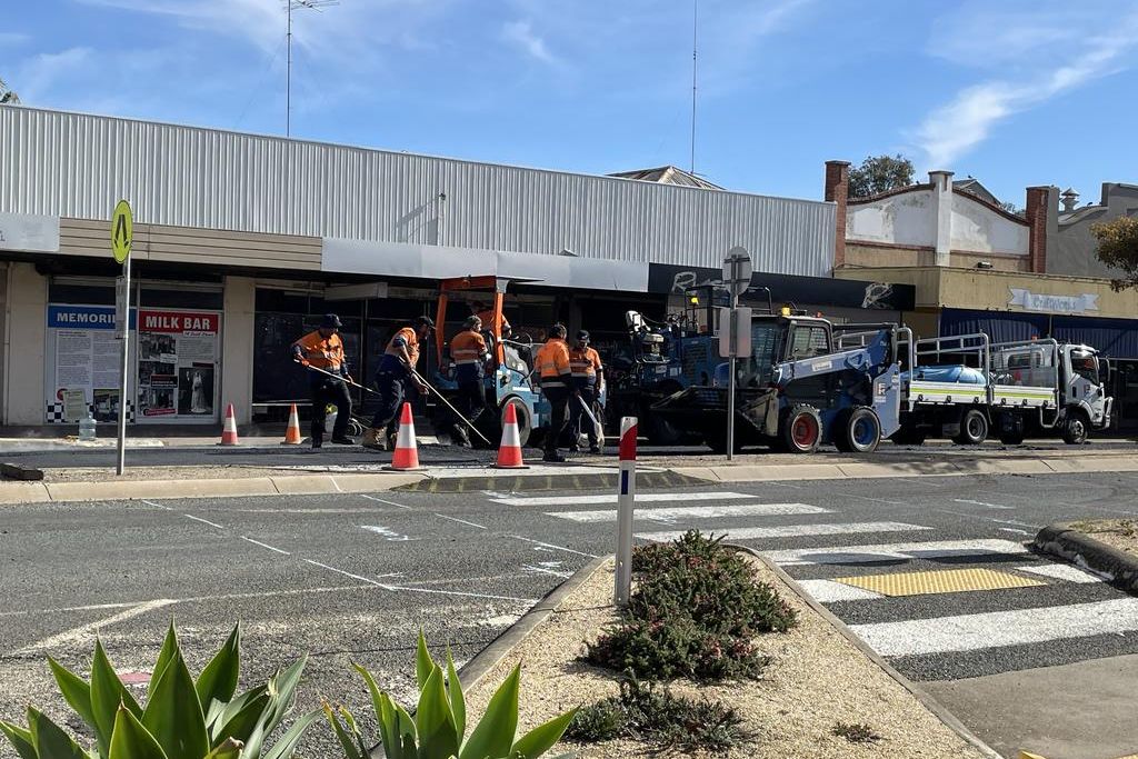 Workmen on site during the installation of the wombat crossing in Scott Street near Commonwealth Bank earlier this year. Photo: CAITLIN MENADUE