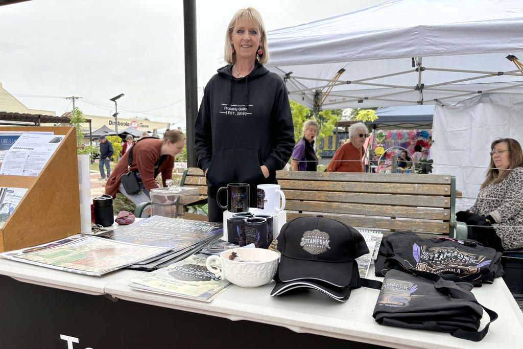 Dimboola Progress Association president Kaylene Pietsch keeps watch over the Tourist Information stall. She sold 2023 Steampunk Festival merchandise alongside maps and brochures. Photo: CAITLIN MENADUE