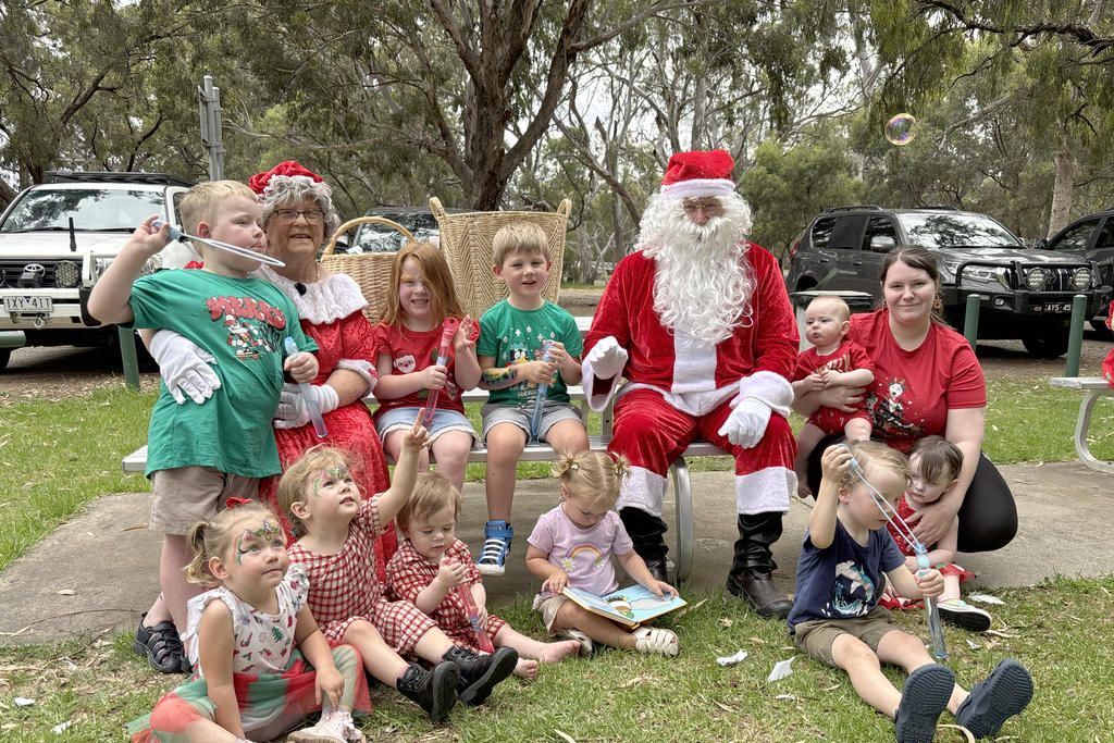 Some of the lucky children who got a visit from Santa and Mrs Claus at Playgroup's Christmas party. Photo: CAITLIN MENADUE