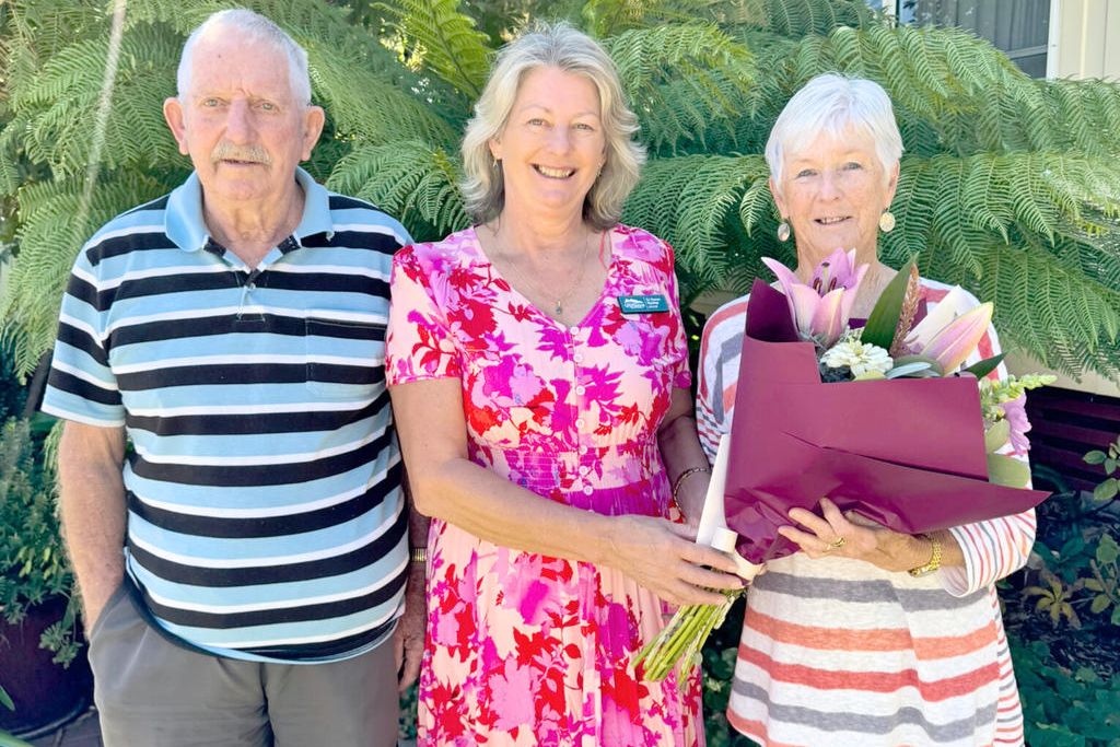Stawell&rsquo;s Noel and Diane Raeburn receive a bouquet of flowers from Northern Grampians Shire mayor &ndash; and their daughter &ndash; Karen Hyslop, to mark their diamond wedding anniversary.
