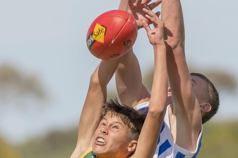 Laharum's Chase Whelan, back, attempts to outmark his Sunraysia opponent.