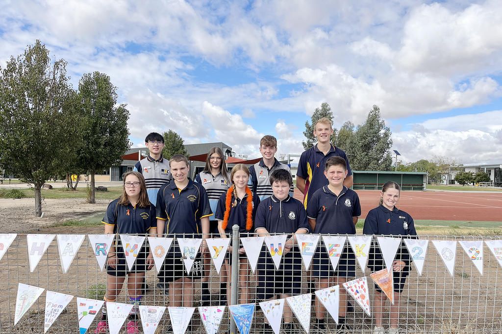 Warracknabeal Education Precinct students show off their Harmony Week artwork: (from left, back) WSC school captain Fionn (Narate) Kamkhuntod, WSC school vice-captain Kalarni Rowe, WSC school vice-captain Joshua Hutchinson, WSC school captain Cody Polack, (front) SDS school eepresentative Aria, SDS school representative Ajay, WPS captain Esmae Clark, WPS vice-captain Chase Bailey, WPS vice- captain Harvey Thomas and WPS captain Daisy Somers.