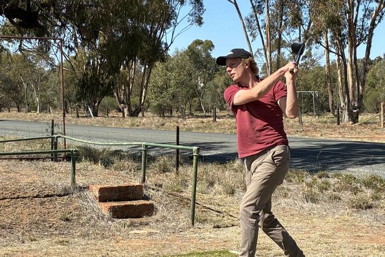 Heath Johns tees off.