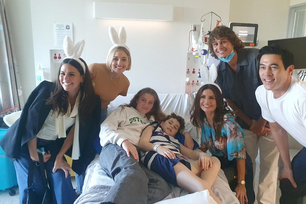 Fletcher and his sister Kirrily with cast members from Home and Away.