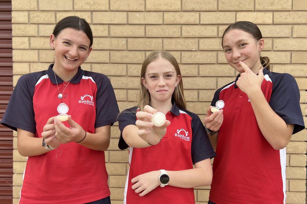Rainbow P-12 College students Ruby Tregenza, Inara Petschell and Amaya Eckermann show off their handmade 'Chapped' lip balms.