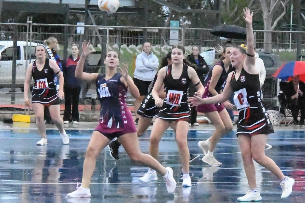 Georgie Carberry from Horsham Demons keeps her eye on the ball