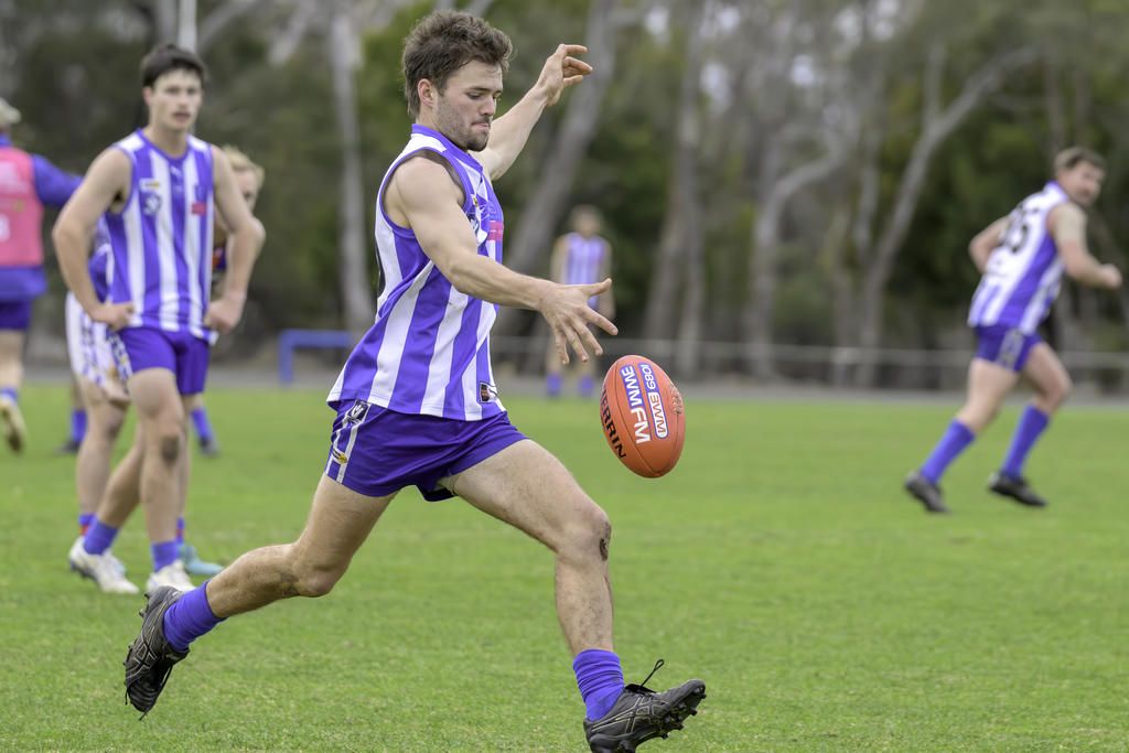 Harrow's Mitchell Grant kicks upfield.