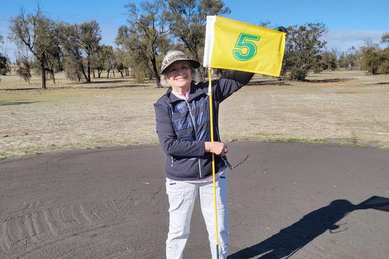 Helen Fisher is all smiles after hole in one.