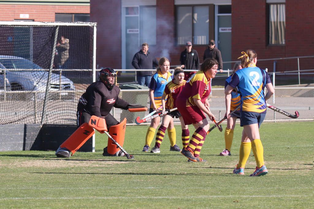Warrack goalkeeper Mel Bentley and defenders Kate Williamson and Jess Boyd brace to repel another Nhill Thunderbirds&rsquo; attacking drive.