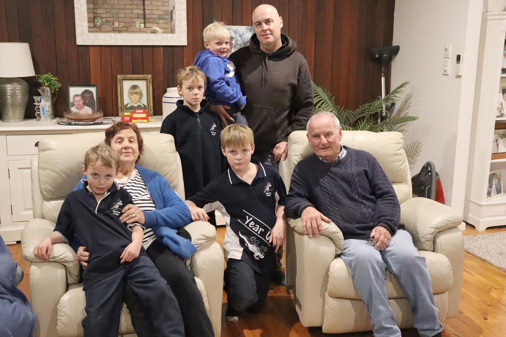 Three generations of the Byrne family face losing their homes to mining. L-R Tommy 7 with Marie Byrne, Sammy 9 with David 'Mick' Byrne holding Benny 5, Joey 11, and Peter Byrne.
