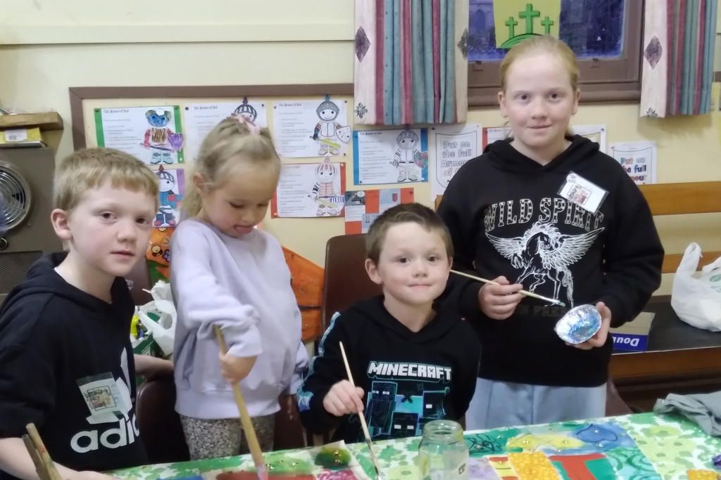 Hayden, Kalarney, Jaxon and Adalyn creating the colourful coat.