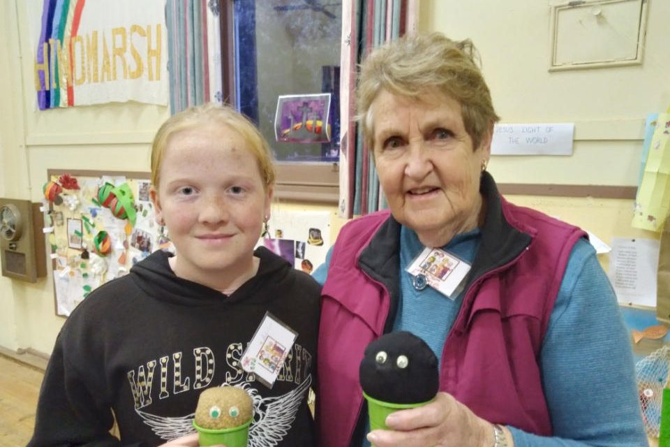 Adalyn Clugston with Elaine Nitschke and their newly planted &ldquo;Wheat heads&rdquo;.