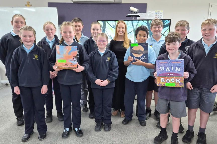 The Year 5 and 6 students with signed books from author Jodie Toering. Left to right: Back Row: Harlow, Indi, Ryan, Miki, author Jodi Toering, Caleb, Kirby. Front Row: Chloe, Heidi, Maddi, Nathan, Edi, Lachlan.