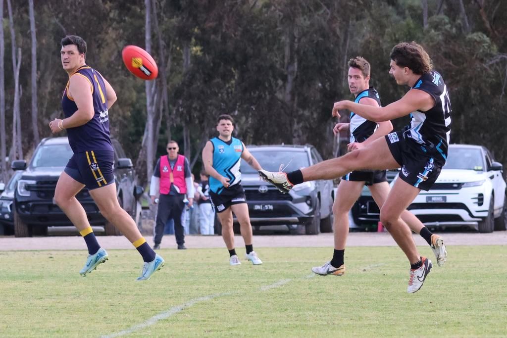 Patrick Grace-Long kicks the ball forward.