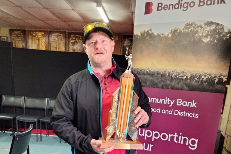 Jeparit captain Glen Treverton proudly holding a rather large trophy.