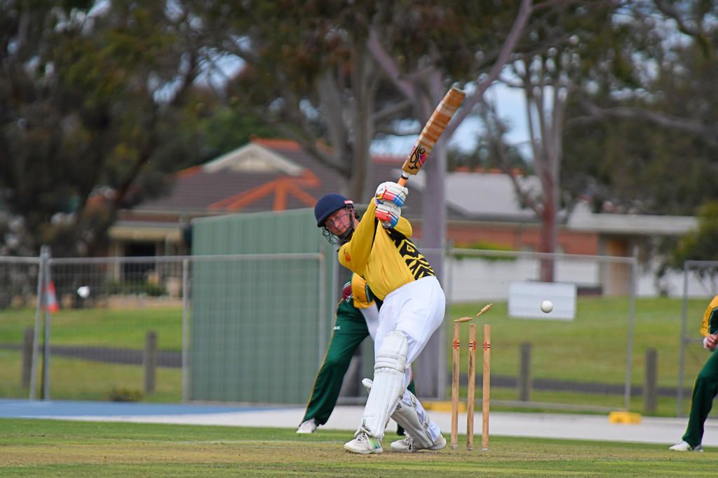 Tigers' Callum Jackson is bowled by Brim KSH's stand in captain Lachlan McGinniss.