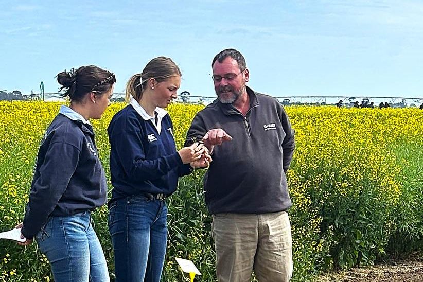 Longerenong Agronomy students, Amelia Lymer (Left) and Eliza Mounsey present their trial results with Tim Davey of BASF