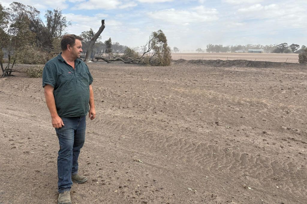 Horsham Rural City Council mayor Brian Klowss looking across his property less than 24 hours after fire tore through his hometown of Natimuk.