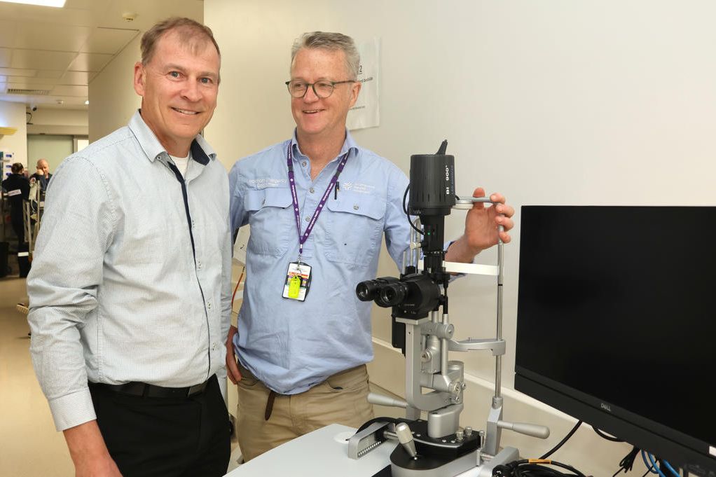 ED Head of Unit Dr Peter Cater, right, shows the new slit lamp to WHCG Foundation director Richard Goudie.