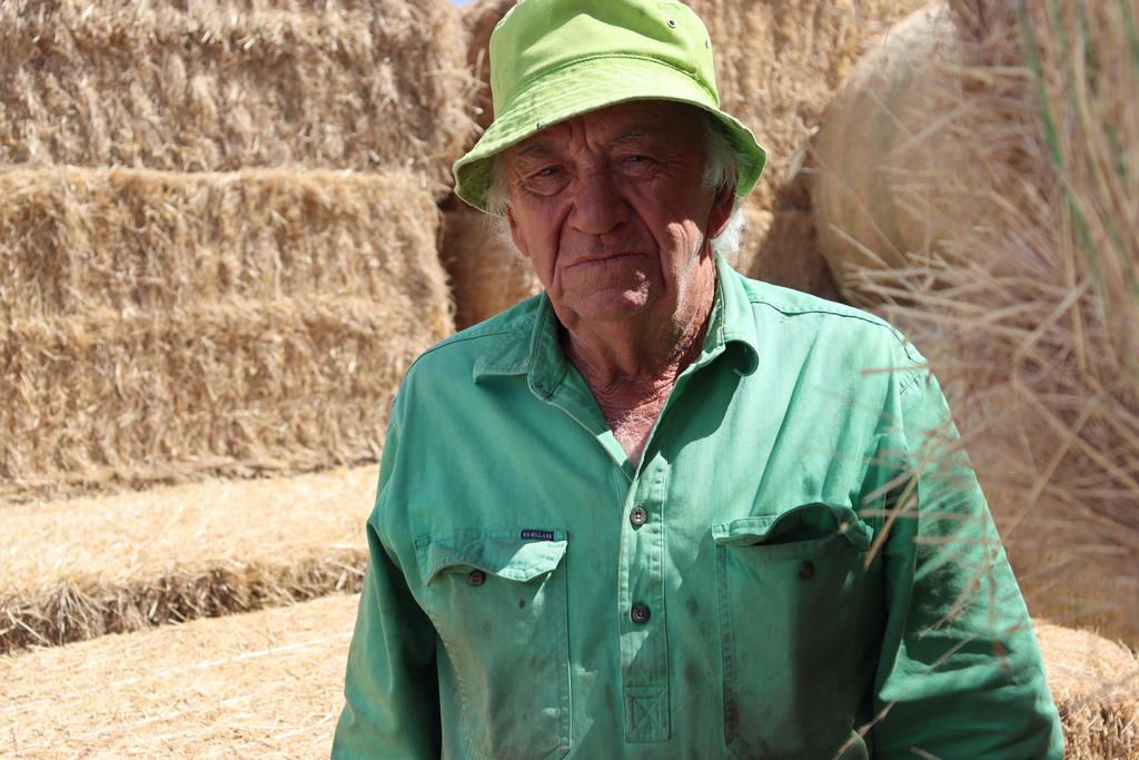 Ken Hateley is grateful to the farmers from near and far who donated hay for his sheep after the Grass Flat Fire on January 9 destroyed his paddocks.