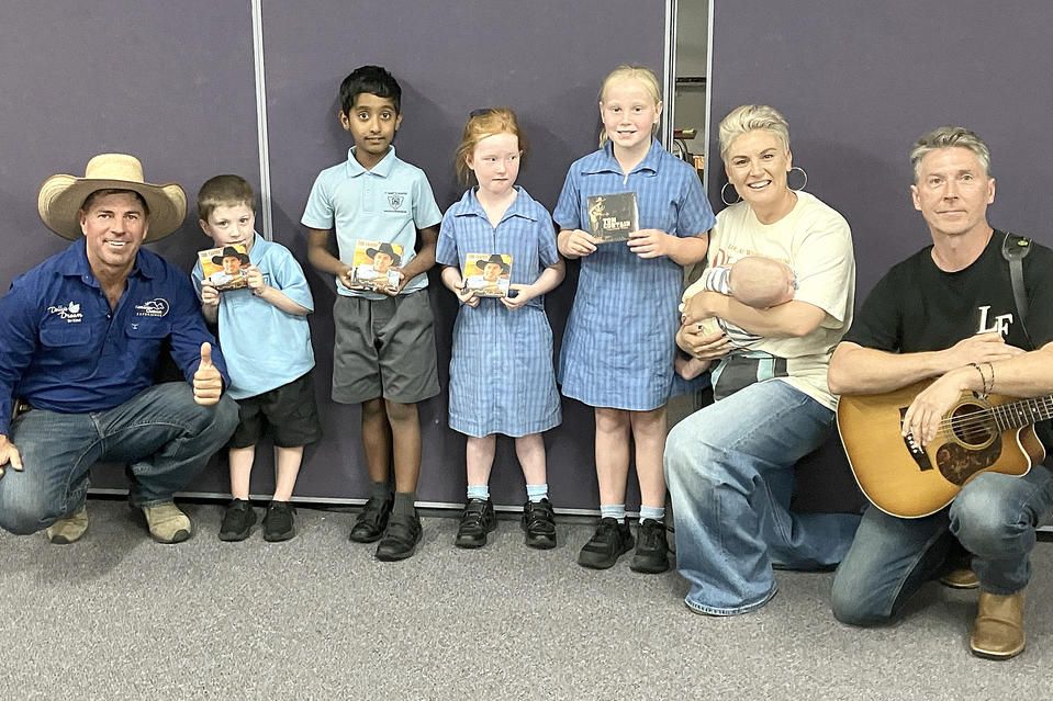 Tom Curtain with St Mary's Primary School students who received awards for participating in his message to stop bullying and entertainers Laura Frank and Chris Matthew.