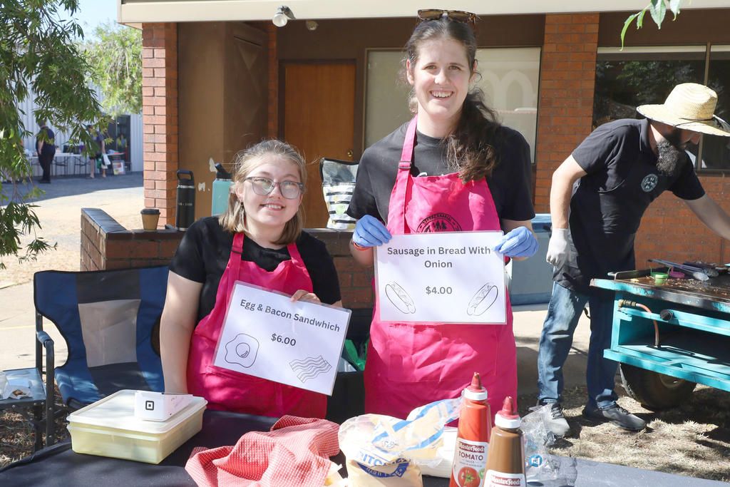 Lions Club helpers Izzy Bandy and Amelia Drage at the stall during the last market.