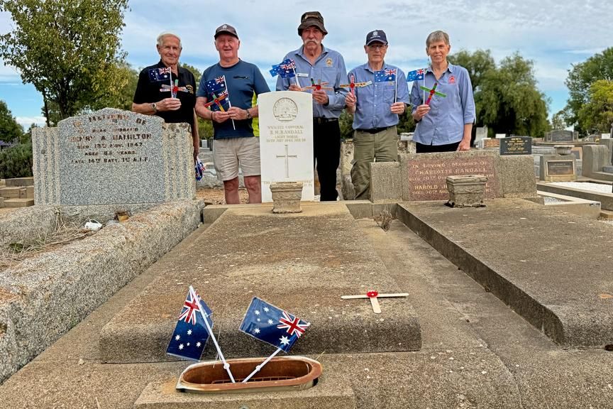 Horsham RSL's Colin Hill, Tony Lawrance, Mark Griffin, Barry Barnett and Sally Bertram place crosses made by Wimmera Lutheran College pupils for Anzac Day.