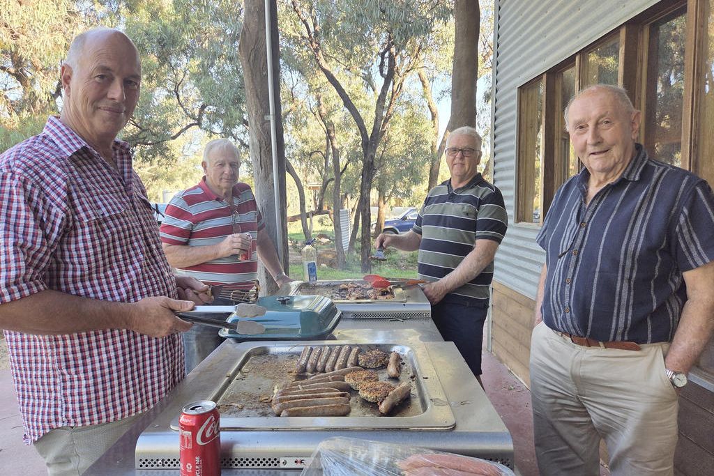 Roger Smith, Jim Harmer, Daryn Clugston, and Graeme Smith at the feast.