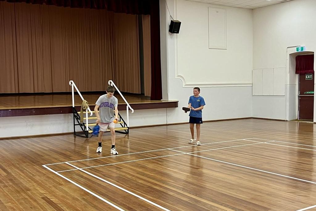 Local kids Tyler and Hendrix trying pickleball for the first time.