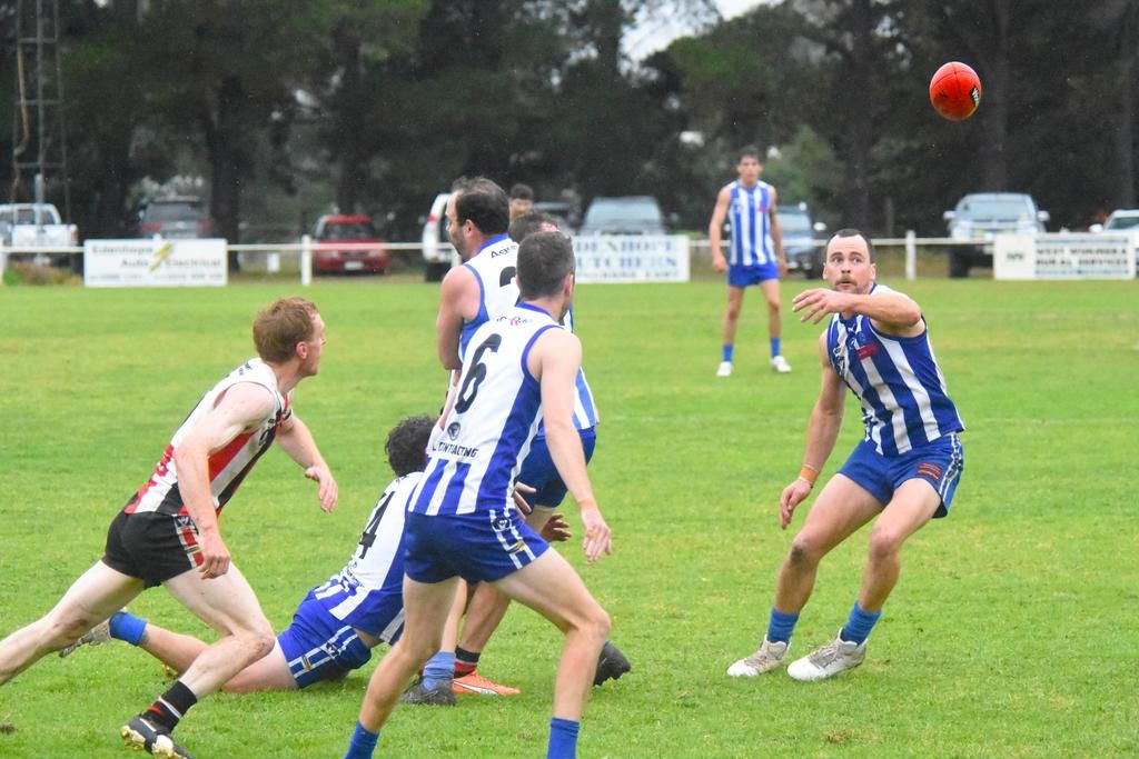 Harrow Balmoral's Peter Staude (right) tracks the loose ball against Edenhope Apsley. The Southern Roos came away with a convincing win.