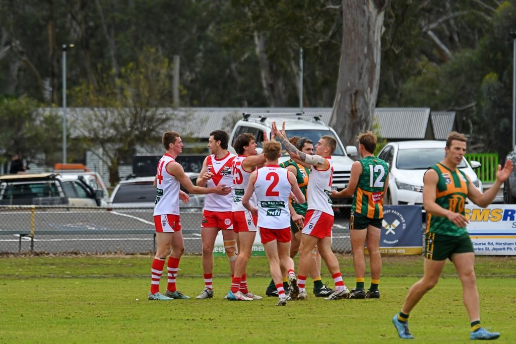 Ararat players come together to celebrate a goal on Saturday.