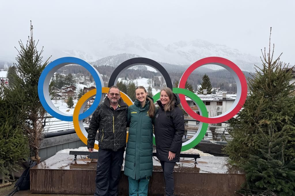 Ararat-raised Sarah Blizzard (centre) with her parents at the recent Winter Olympics.