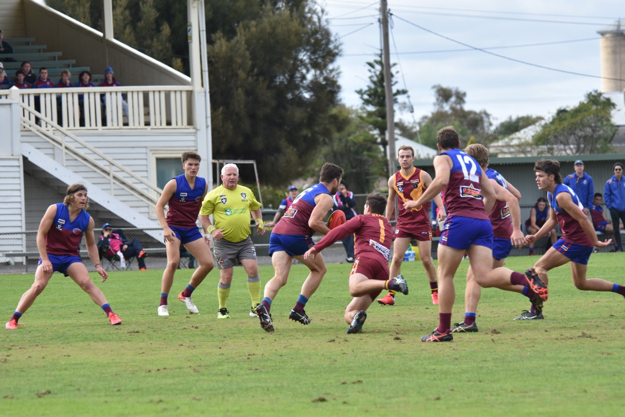 STRUGGLE: Demons and Warrack players fight over the football. Photo: SAMMIE LOUISE.