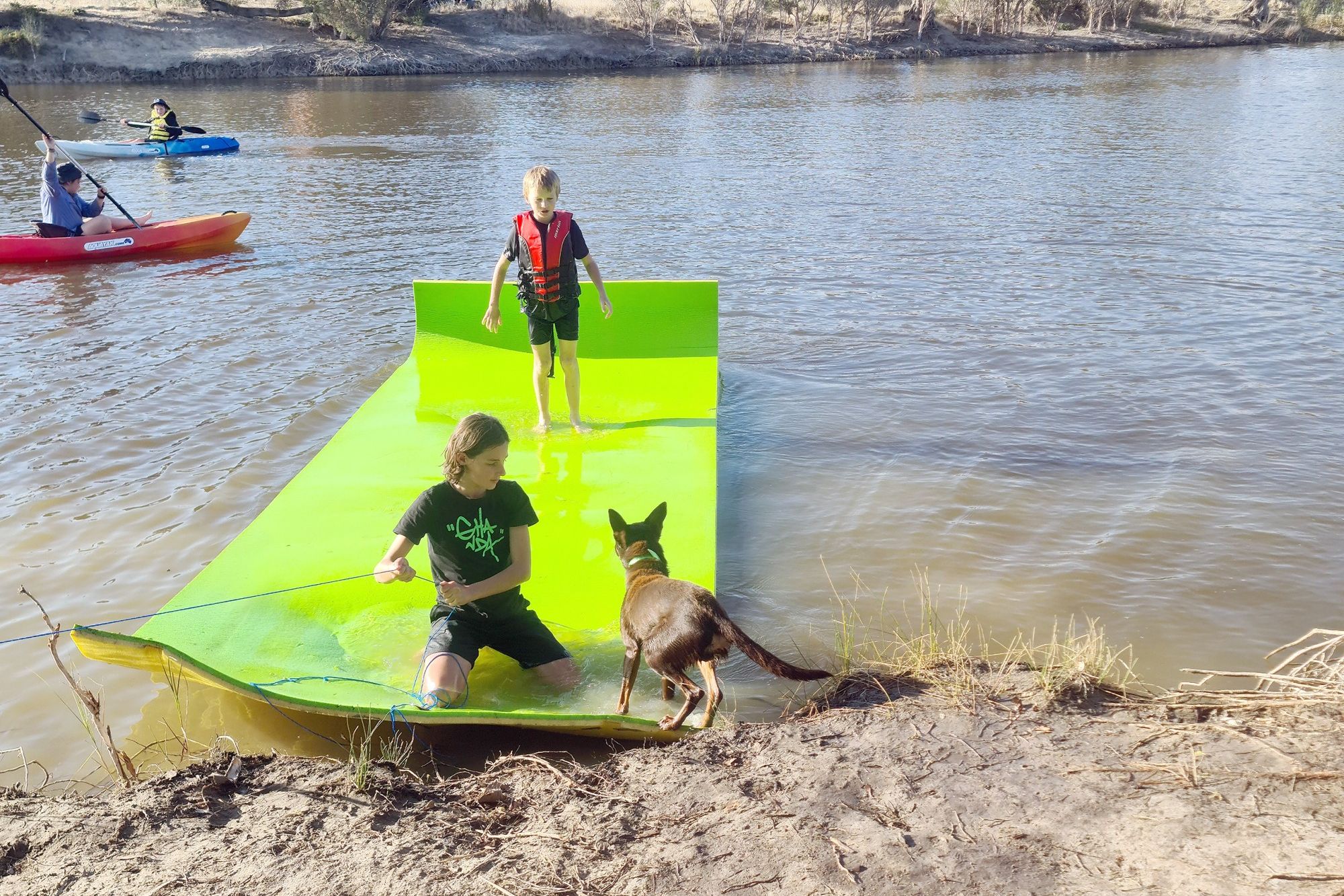 Flynn Hutson (front) and Sam Murnane enjoy the waters at the family camping site in Jeparit during last year's Fishing Comp.