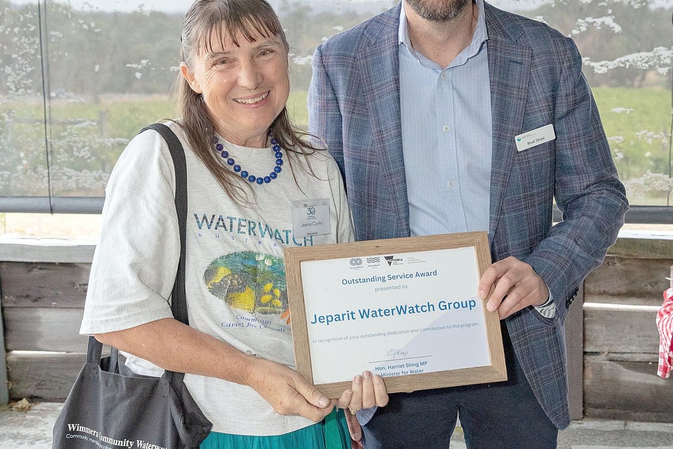 North Central Catchment Management Authority chief executive Brad Durst presents Jeparit WaterWatch Group representative Jeanie Clarke with an Outstanding Service Award. The group has been monitoring the Wimmera River for nearly three decades.
