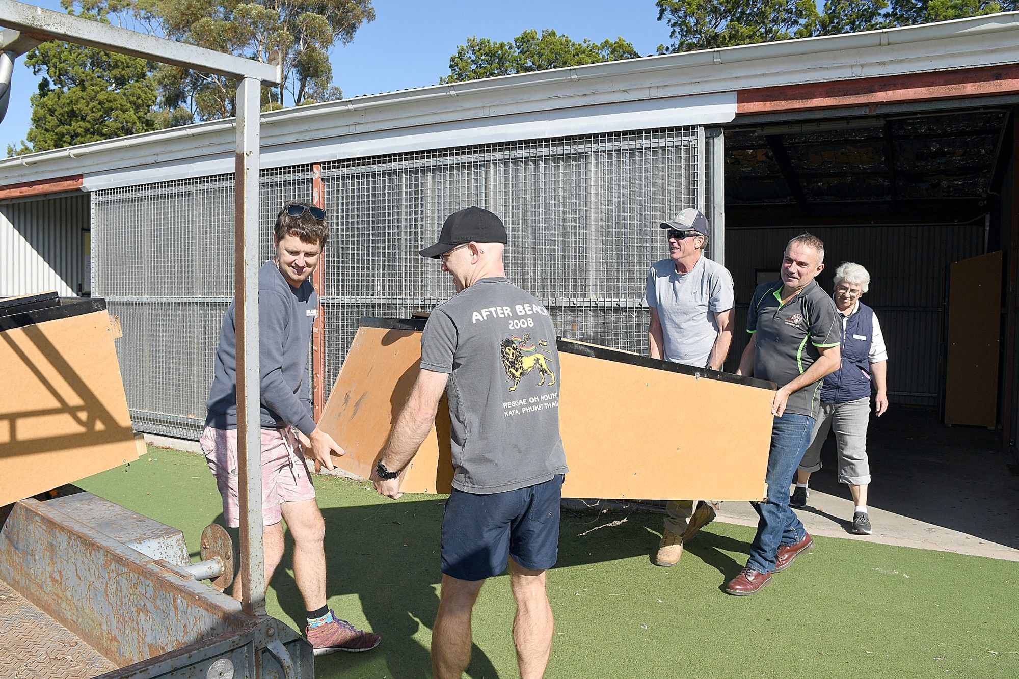 Warracknabeal Secondary College principal Casey Phelan supervises Shaun Winsall, Dale Shannon, Shane Wardle, Peter Loy as they move the school lockers from the old college building to the new Education Precinct ahead of the commencement of Term Two