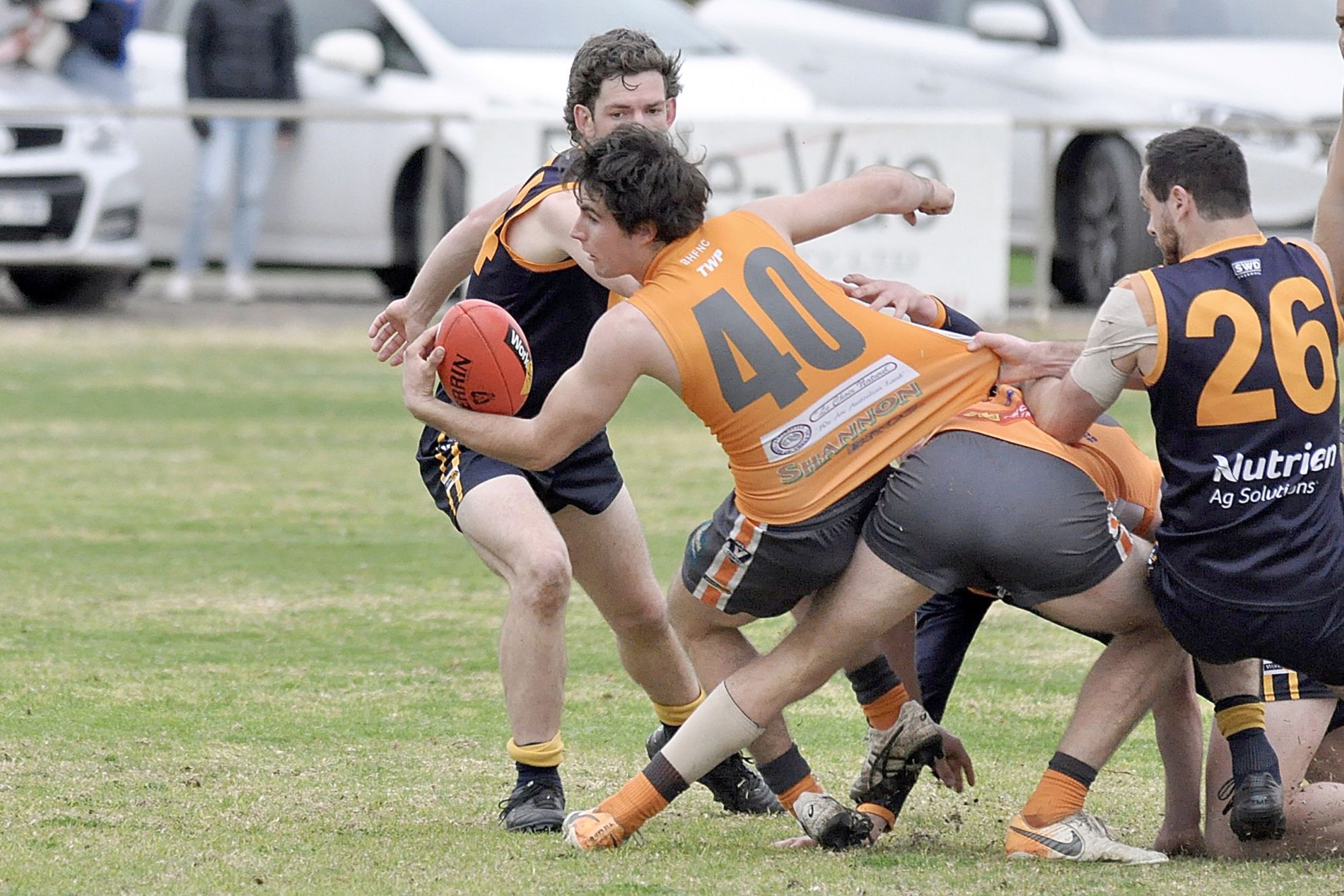 Giants forward Ben McGee looks to dispose of the ball under pressure from his Nhill opponents during Saturday's clash at Beulah.