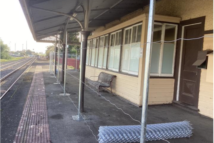 Rolls of wire and posts erected at Nhill Railway Station.
