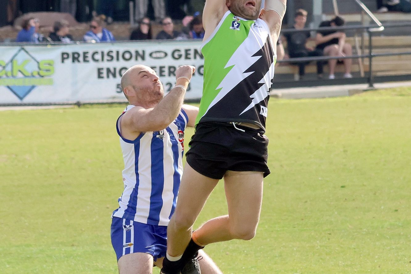 Ash Clugston flies for a mark