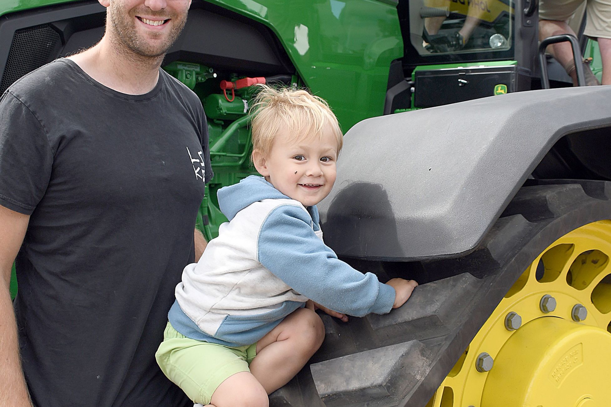 Brim West farmer Sam Tickner and son Eamon check out the John Deere 8RX370 four track tractor on display at the 2020 Wimmera Machinery Field Days event at Longerenong.