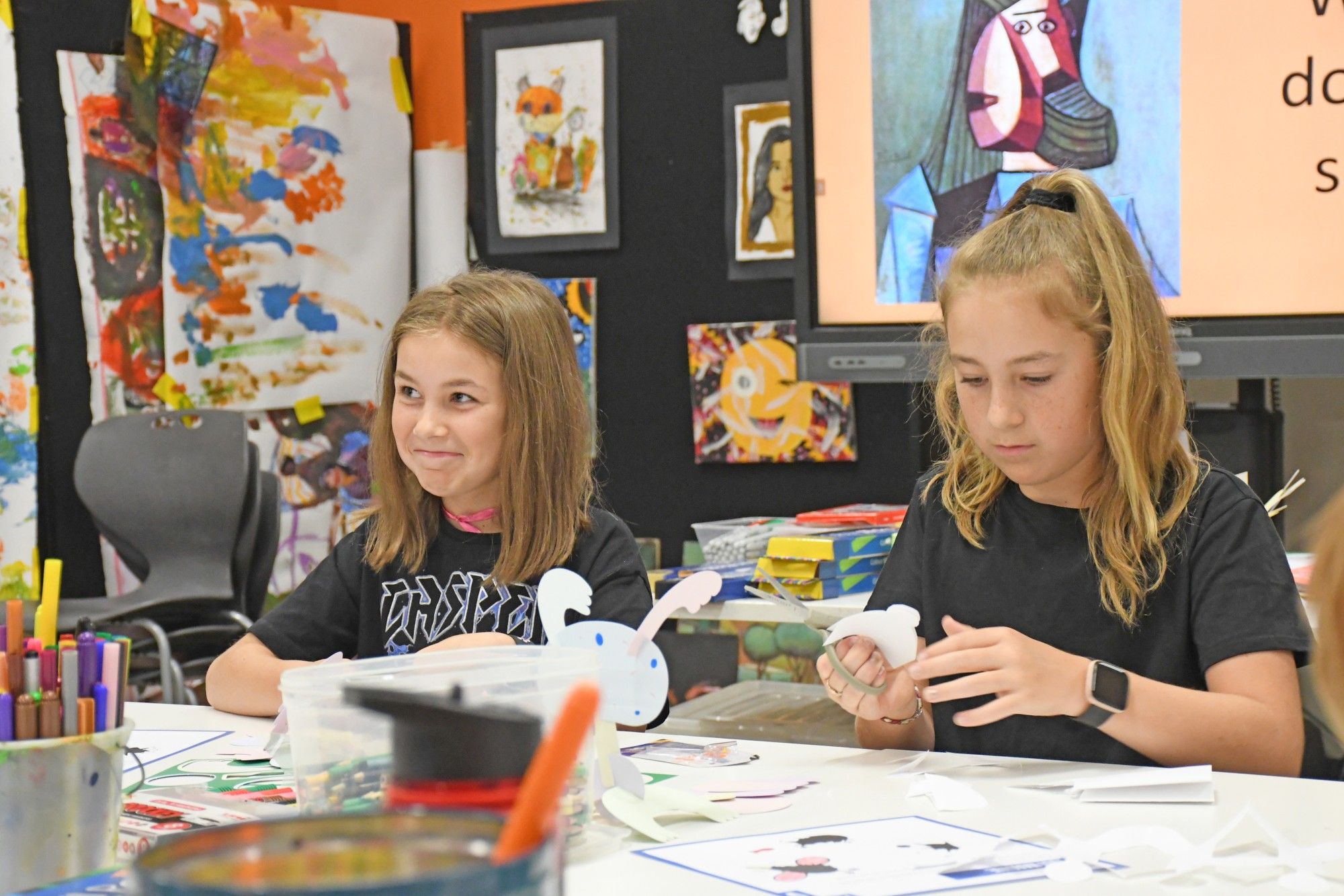 Lucy Butsch, 8, and Chloe Butsch, 11, making crafts at the NGV Kids on Tour program in Horsham.