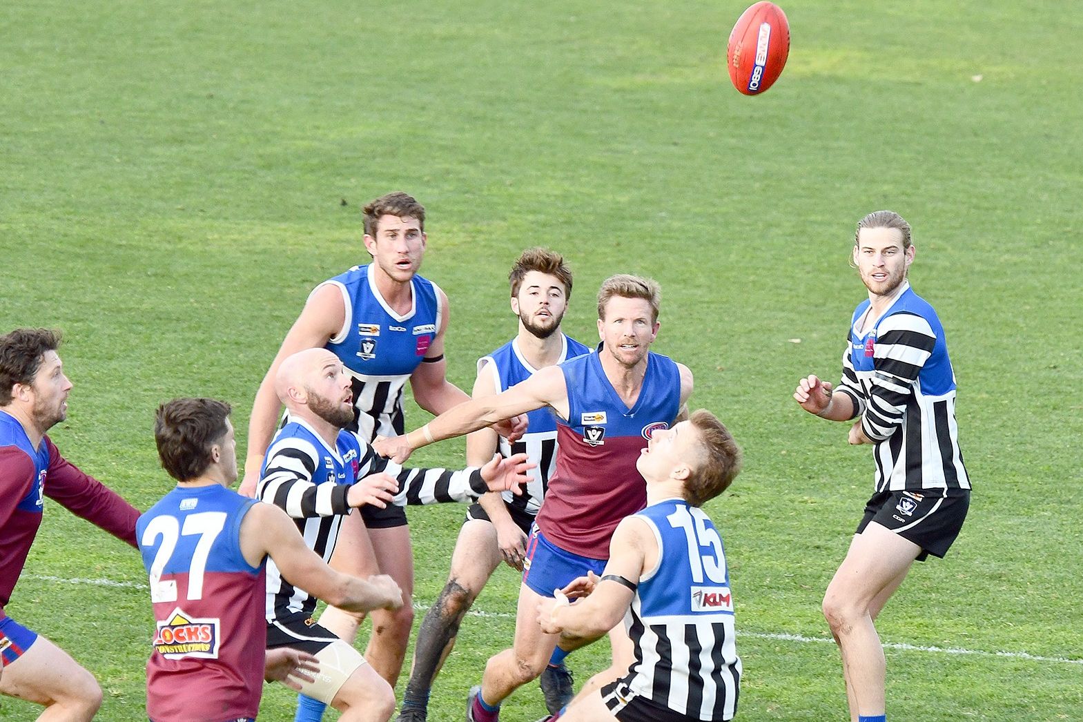 Horsham's Ben Lakin (centre) eyes the prize but has his full hands full forming a one man wall while Minyip-Murtoa's Luke Fisher and Will Holmes prepare to take possession at City Oval on Saturday.