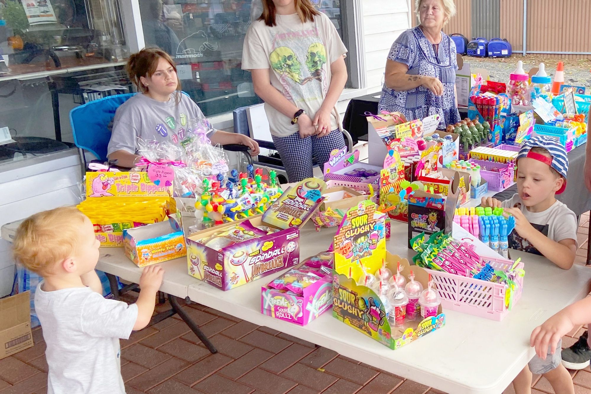 Zoe Stancliffe (right) at her Cross Eyes stall, with family members helping out.