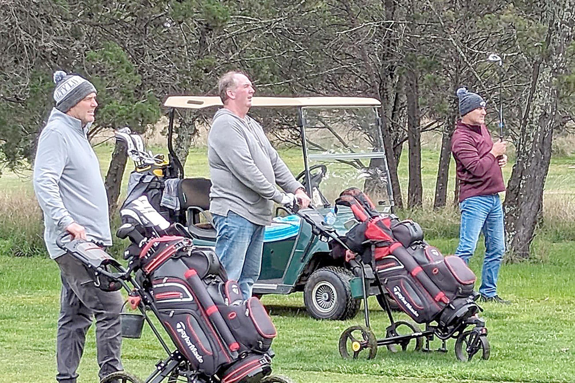 Warrack golfers Dean Gunn and Nathan McLean watch the flight of David Stewart's ball during the opening round of club championships on Saturday.