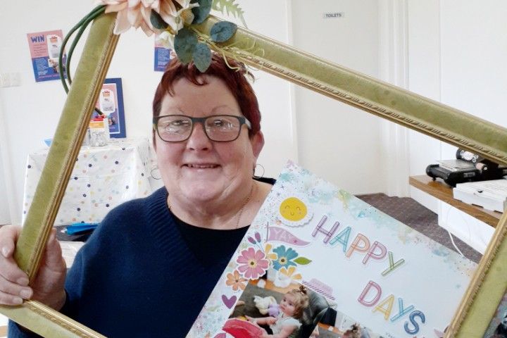 Di Holland uses scrapbooking pages to showcase her family photos
