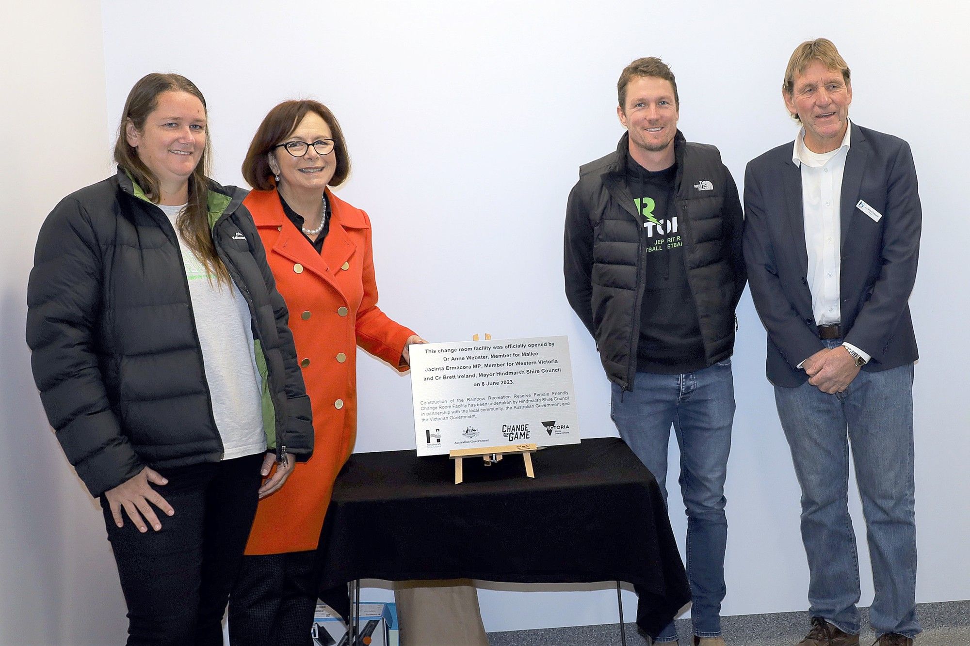 Jeparit Rainbow Football Netball Club's director of netball Ebony Spokes, Member for Mallee Dr Anne Webster, club president Lucas Edelsten and Hindmarsh Shire mayor Brett Ireland unveil the commemorative plaque at the official opening of the new netball change room facilities at Rainbow Recreation Reserve