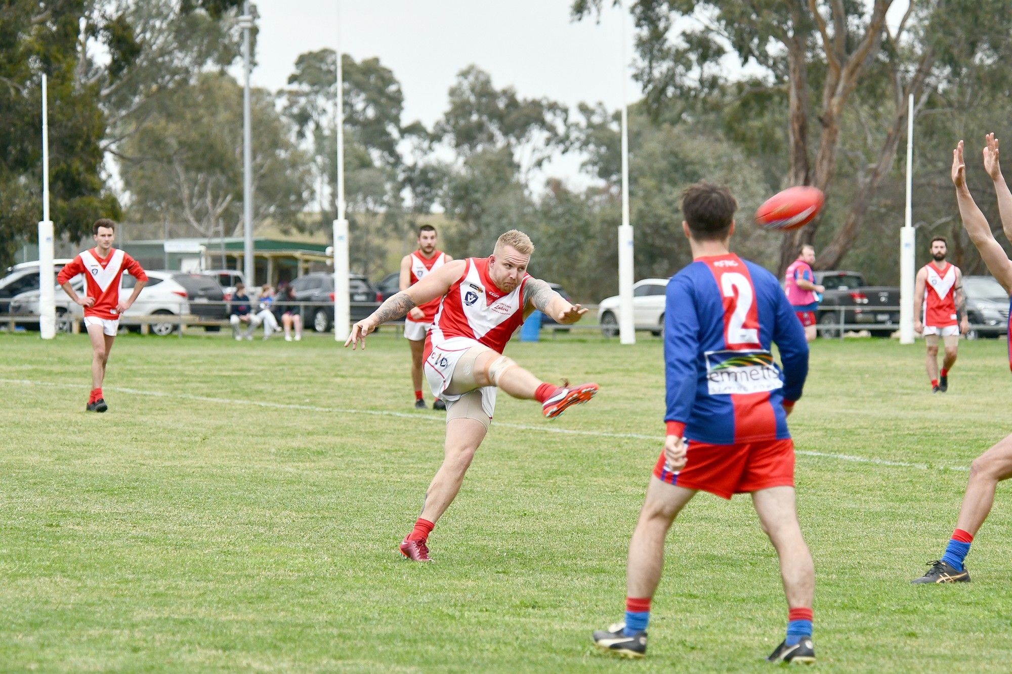 Taylors Lakes' Marc Davey kicks his team into attack during Saturday's clash with Rupanyup.
