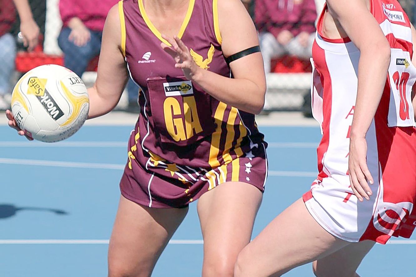 Warrack Eagles shooter Briodi McKenzie looks to move the ball forward against Ararat opponent Annie Shea during their clash at Alexandra Oval on Saturday.